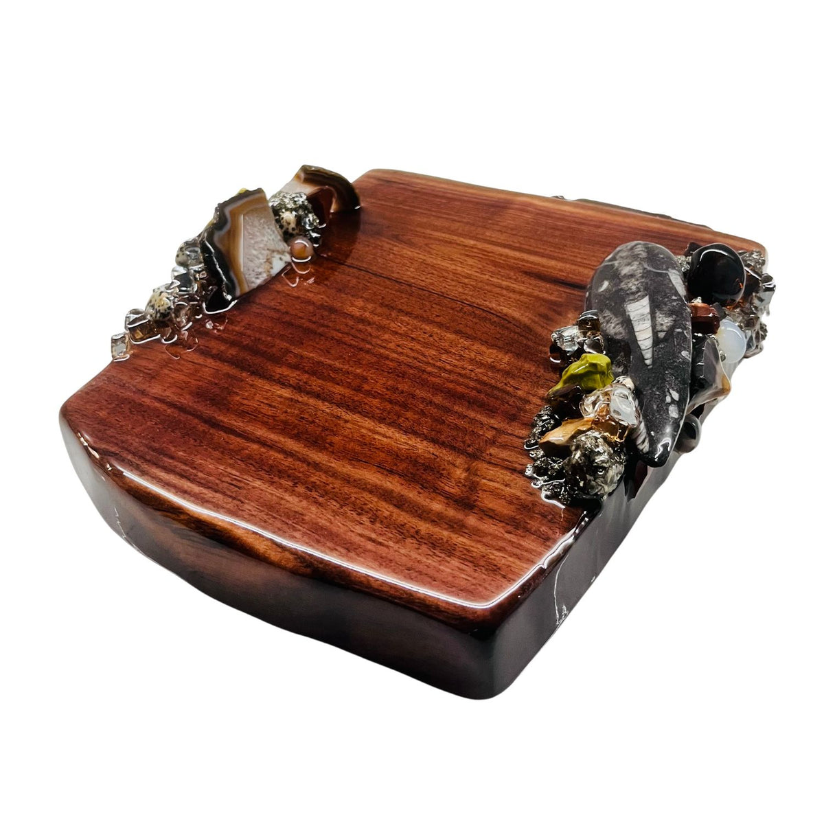 Treasures Vanity Tray with clusters of earthtone minerals and fossils on the 2 long sides.