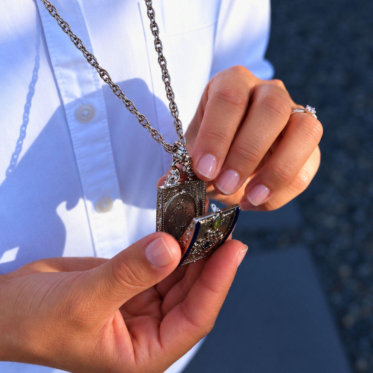 Closeup of woman opening the locket.